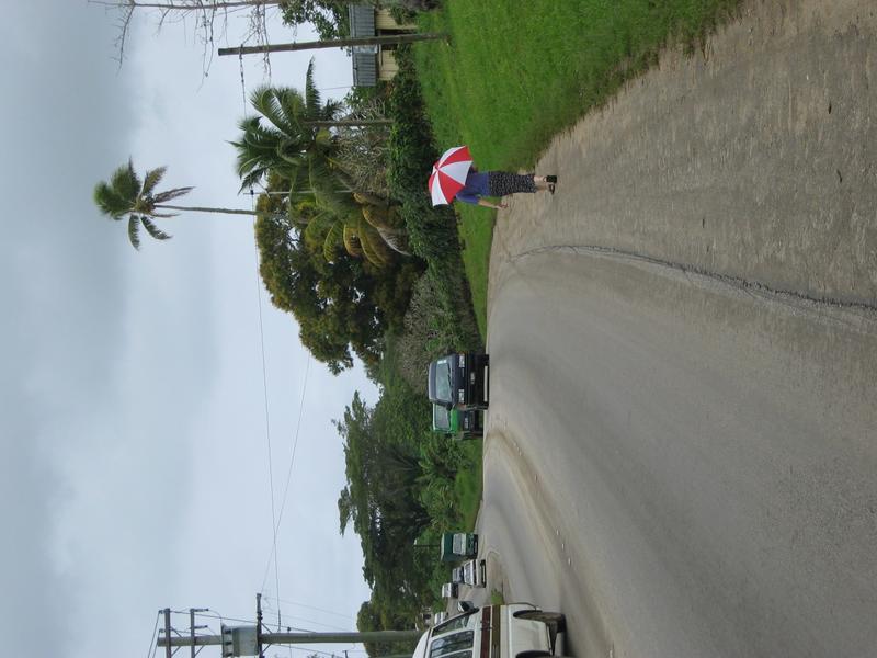 Cherie hiding under the brolly.